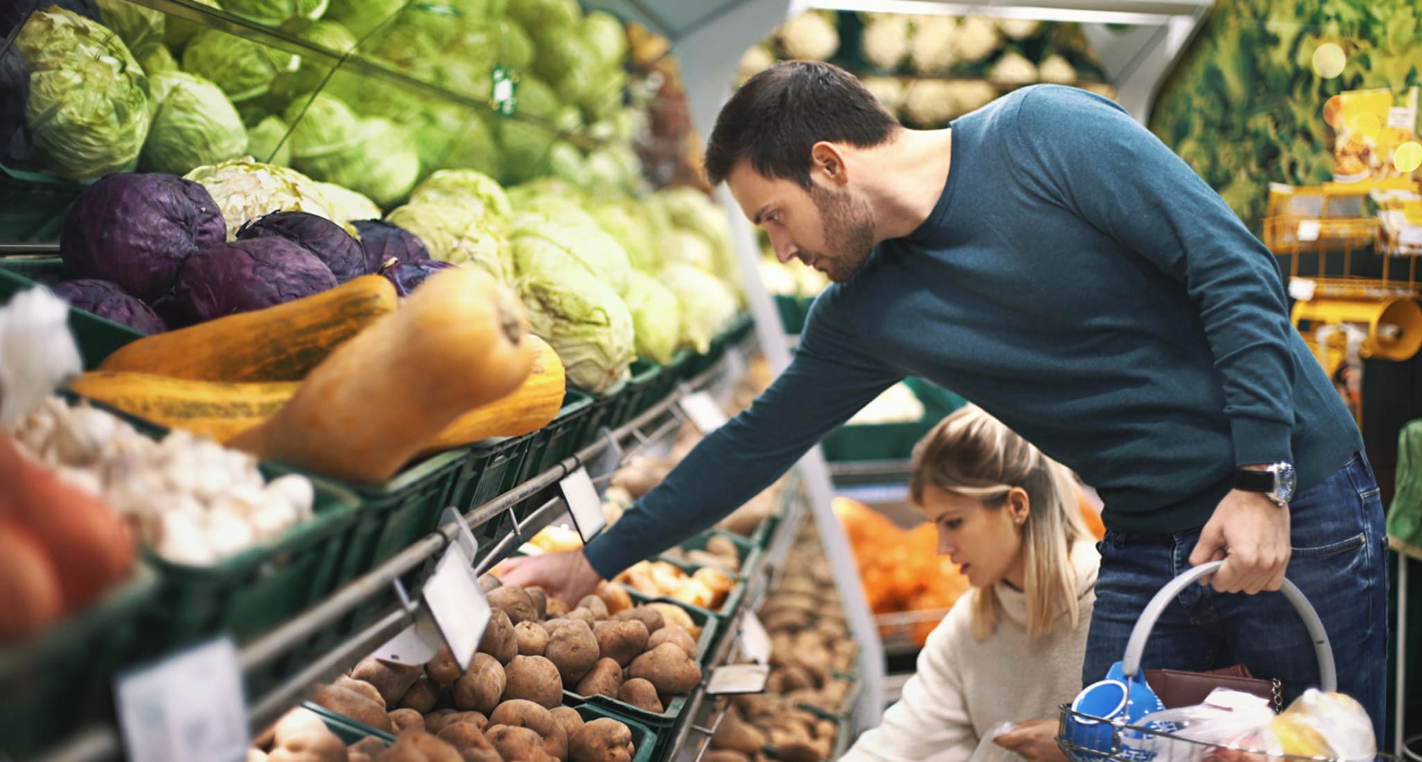 A man and a woman shopping.