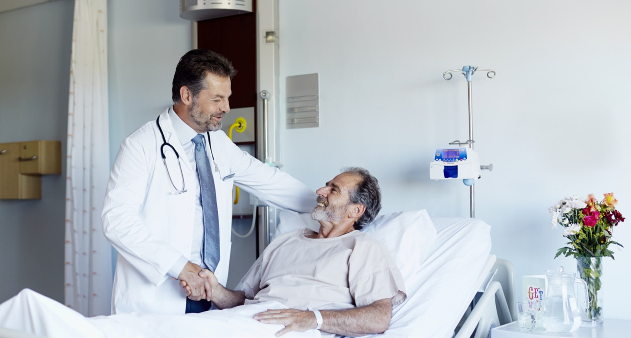 A doctor greets his patient.