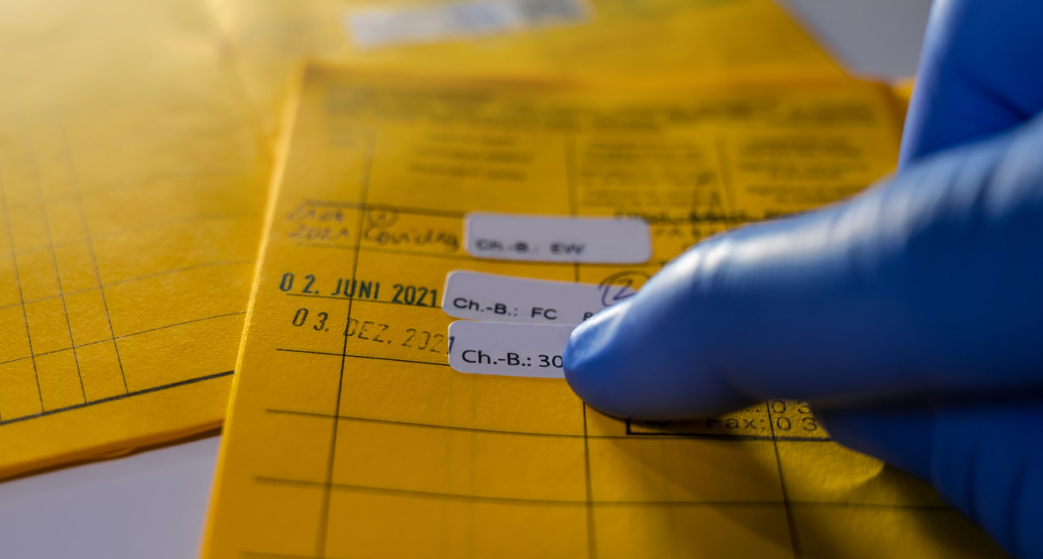 Image of a yellow international vaccination booklet.