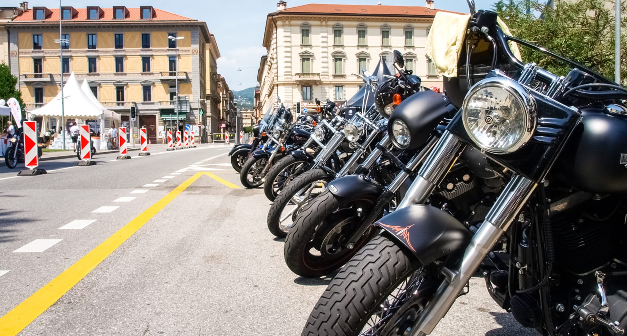 A motorcycle stands outside a building.