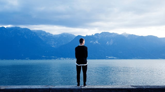 man by a lake