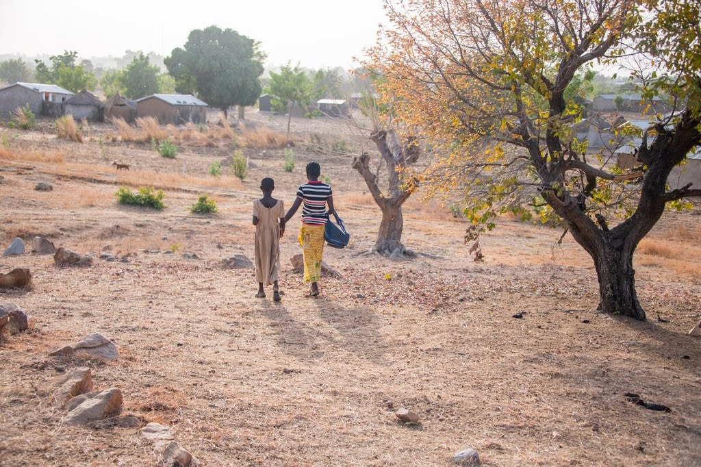 Mother and daughter walking away