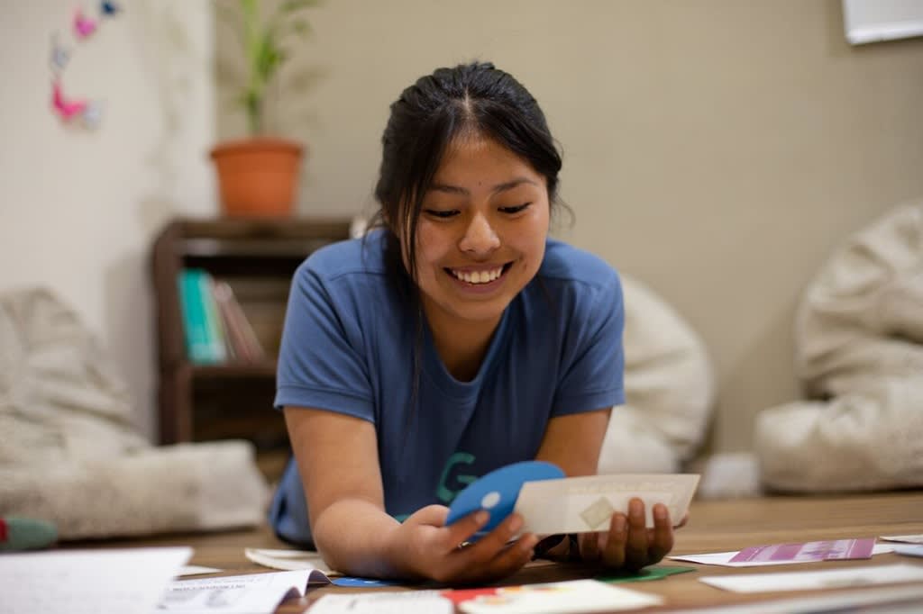 Girl laying on the floor and reading