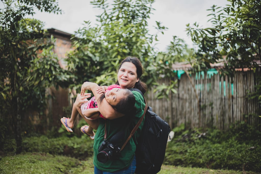 Sara playing with Compassion kids.