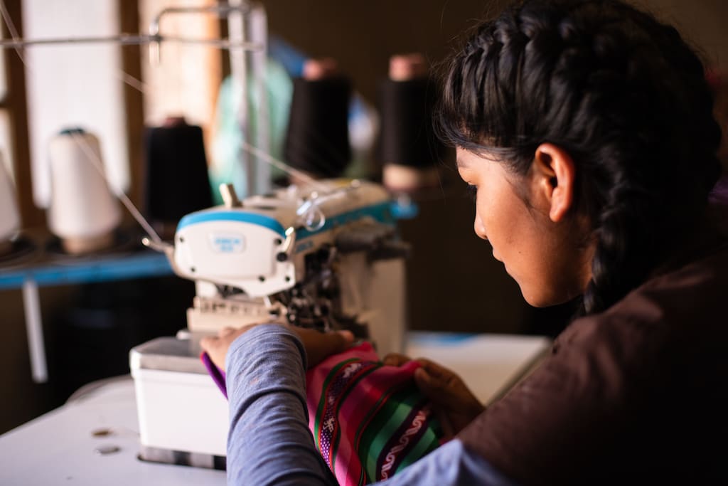 A young woman sewing