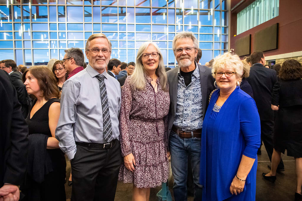 Four guests pose during the pre-event mingling time.