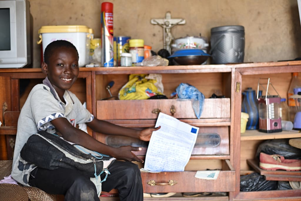 Cyrille in Burkina Faso with letters from his sponsor