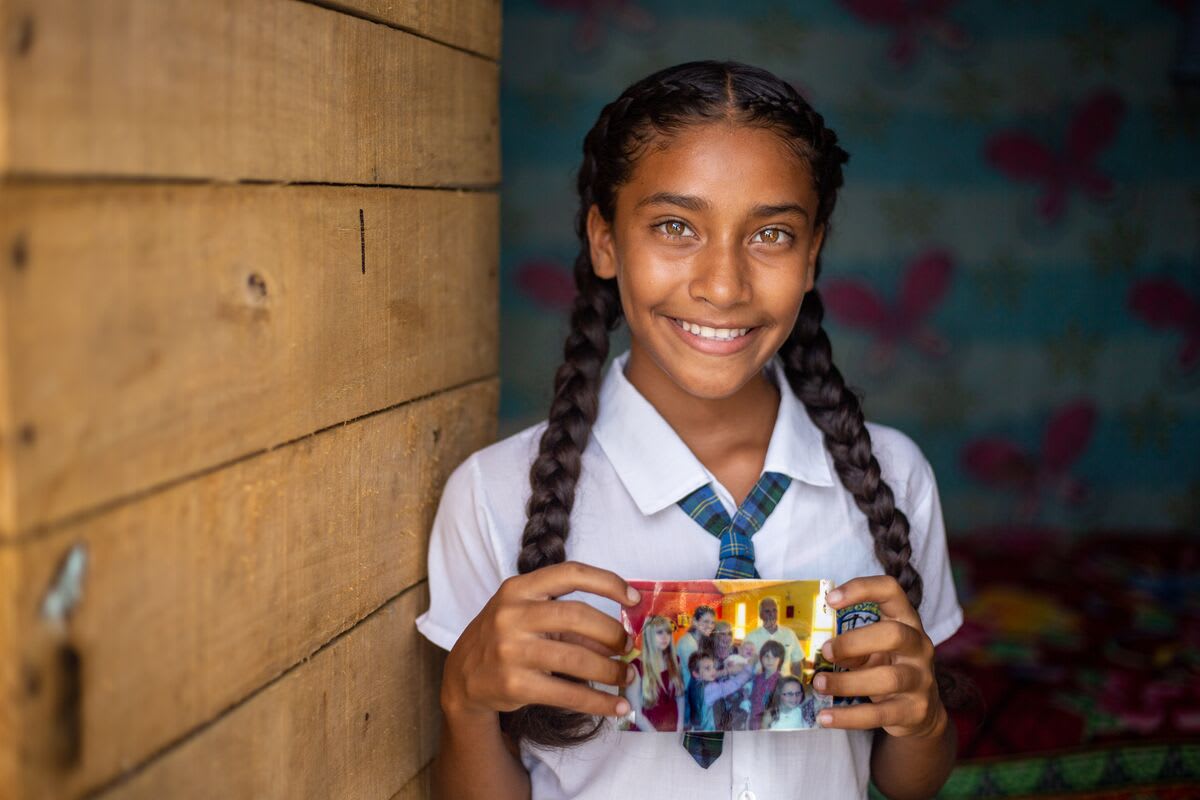 Girl holding a photo