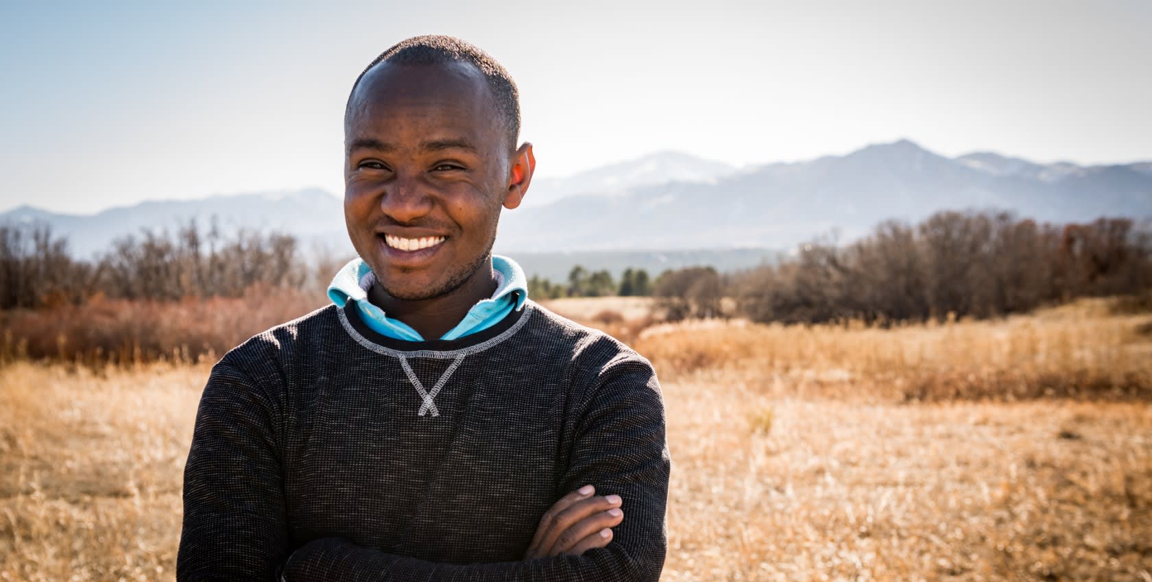 A confident looking young man smiling at the camera