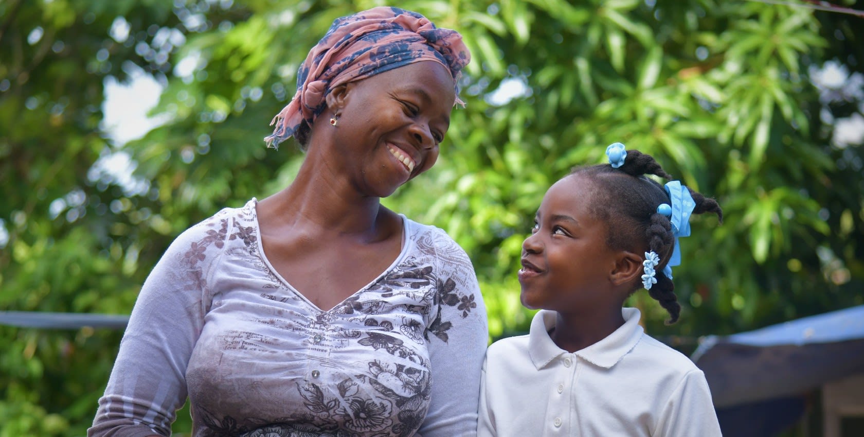 A mother looking at her daughter smiling