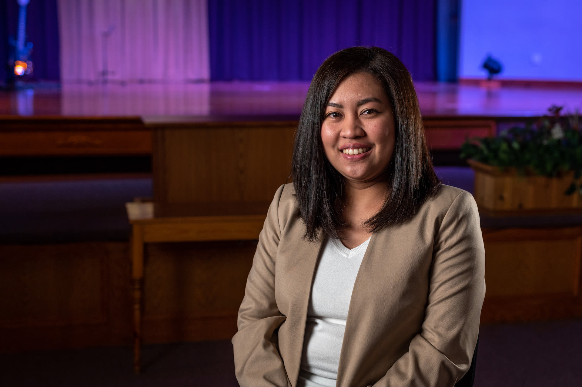 A portriat of Ria sitting in her church.