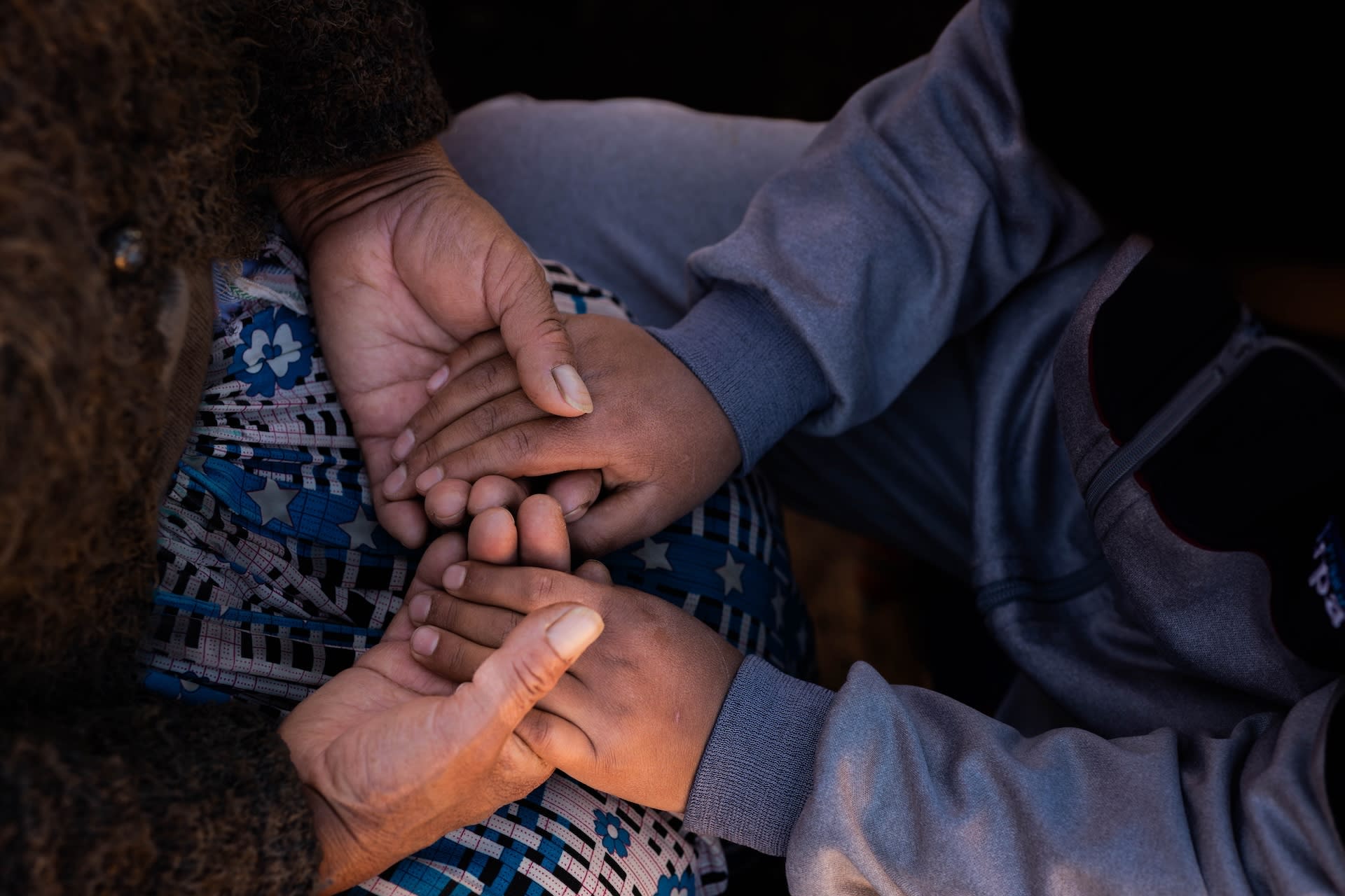 Two people (not pictured) holding hands.