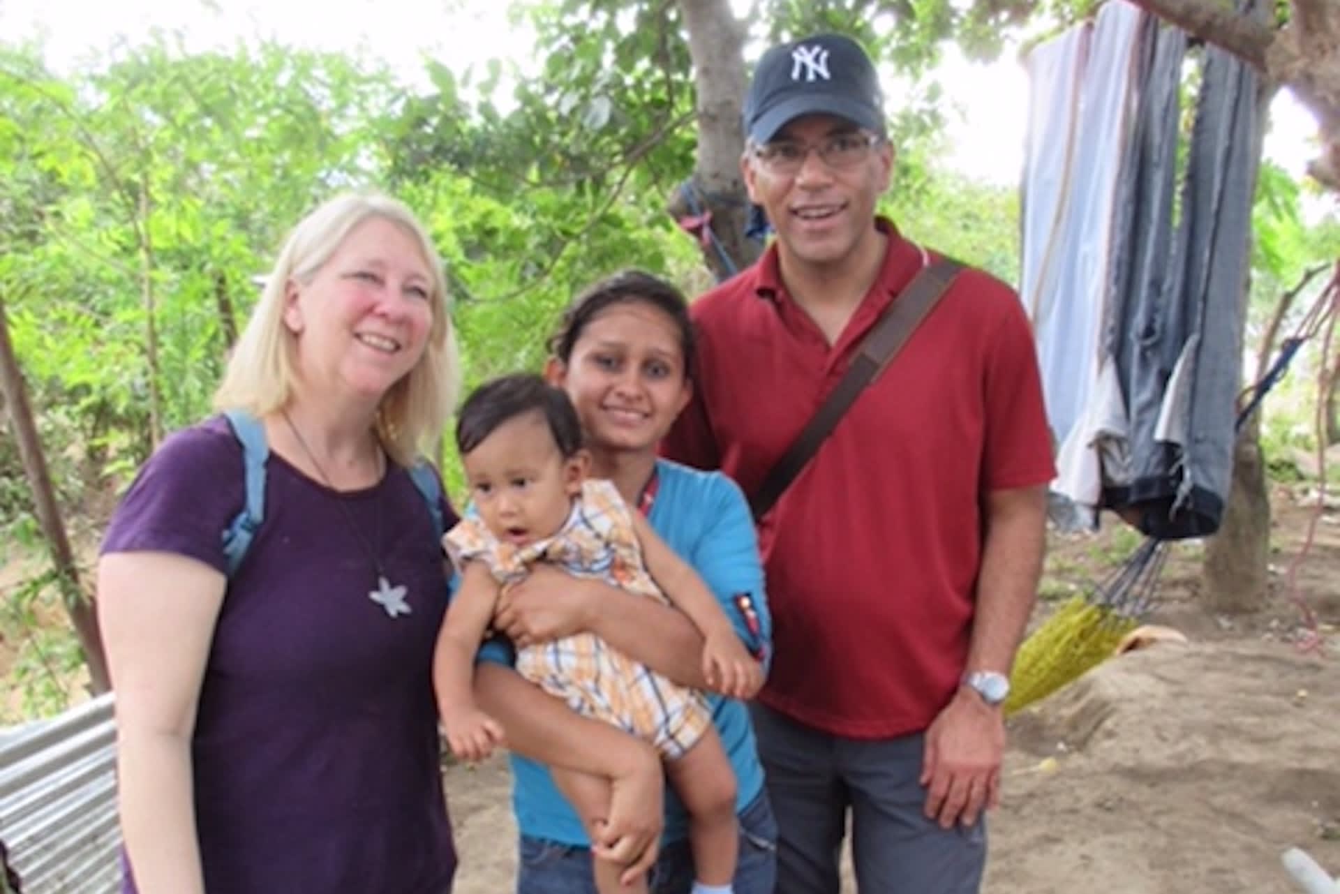 Tim Hague Sr. with his wife Sheryl visiting the home of a Compassion program participant.