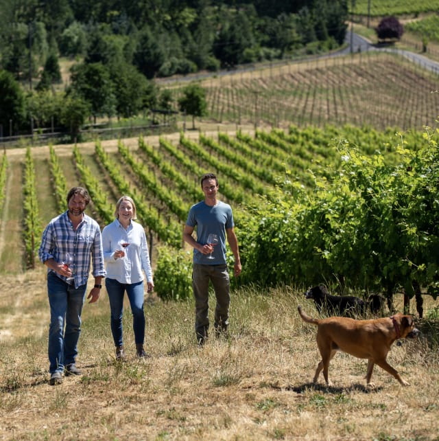 The knowledgeable Compris team enjoying time in their off the beaten path vineyard with a glass of Tempranillo and Rose of Tempranillo, while two dogs explore. 