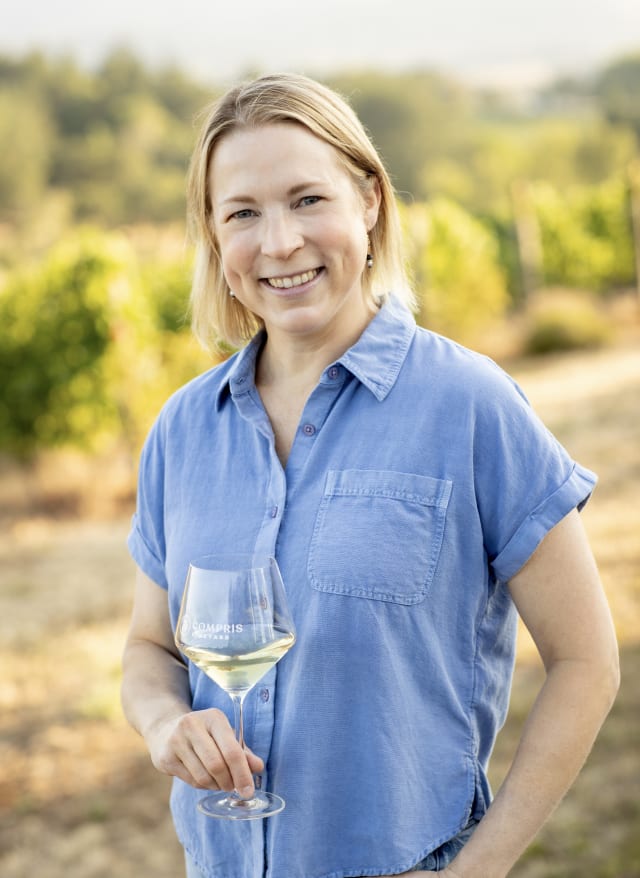 Erin Allen is outside of the boutique tasting room, she enjoys the philanthropic nature of our community and small winery.