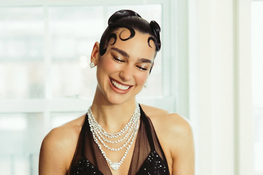 Dua Lipa arrives at the 2025 Met Gala covered in pearls and crystals