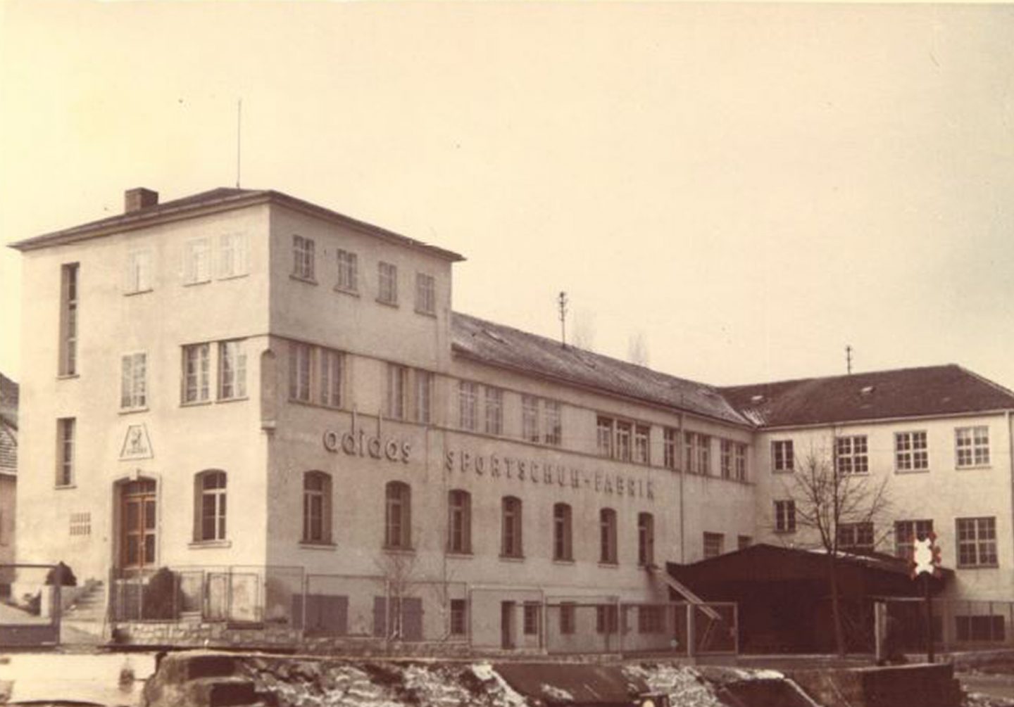 The original adidas production facility in Herzogenaurach, Germany in the 1950s. The company was at the forefront of the sporting goods industry producing technical sporting goods for athletes. ©The adidas Archive