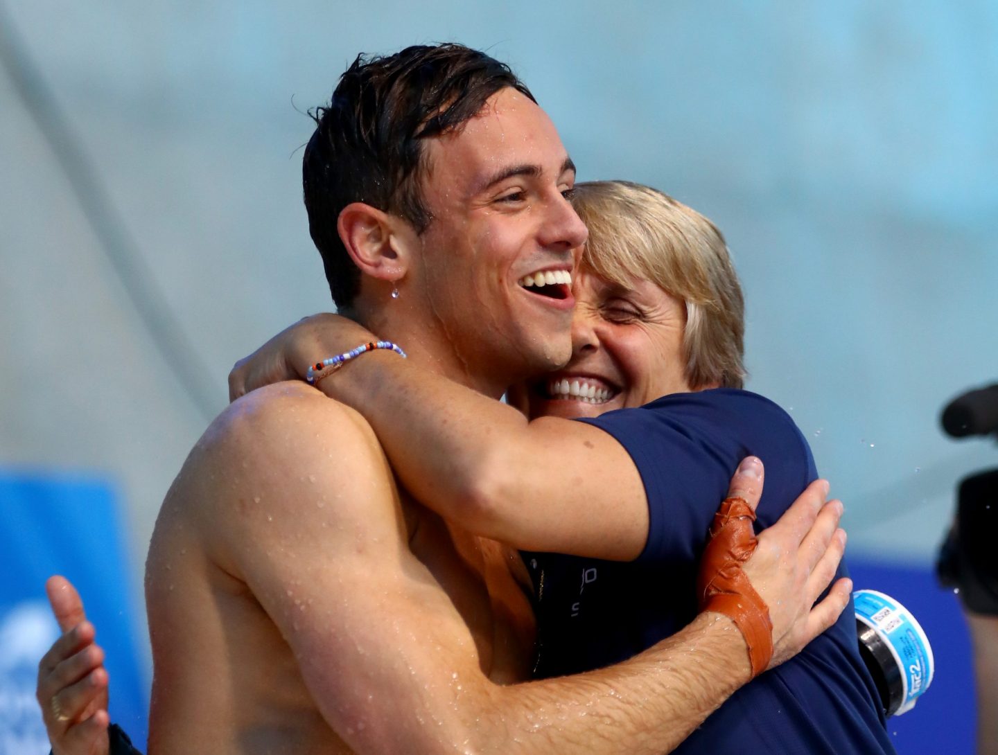 Tom and his coach, Jane Figueiredo, celebrate a win ©Clive Rose/ Getty images