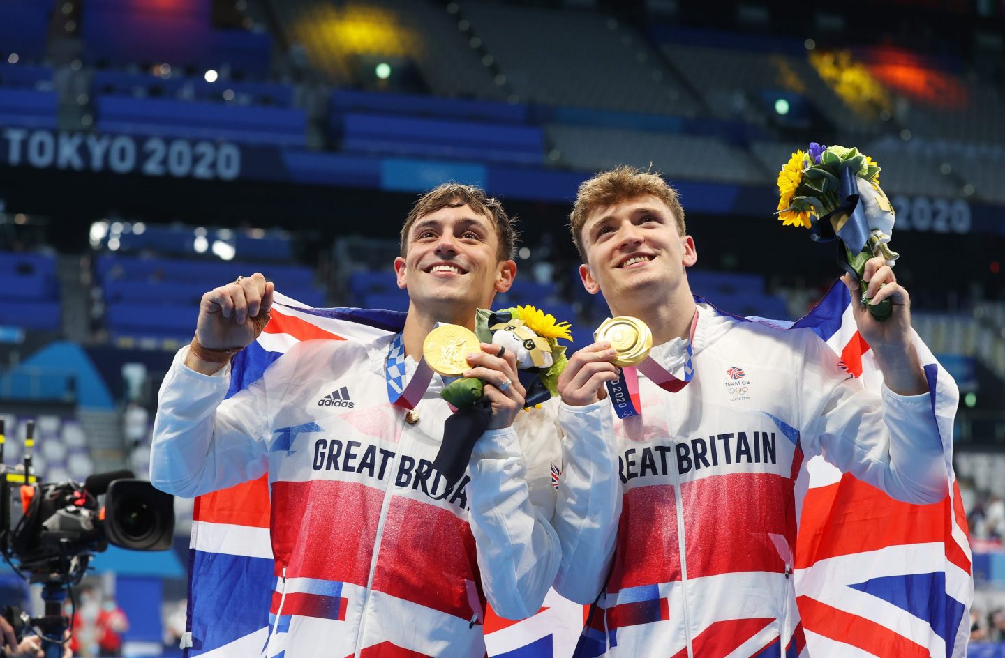 Tom and his diving partner, Matty Lee, revel in their Olympic gold win. ©Clive Rose/ Getty images