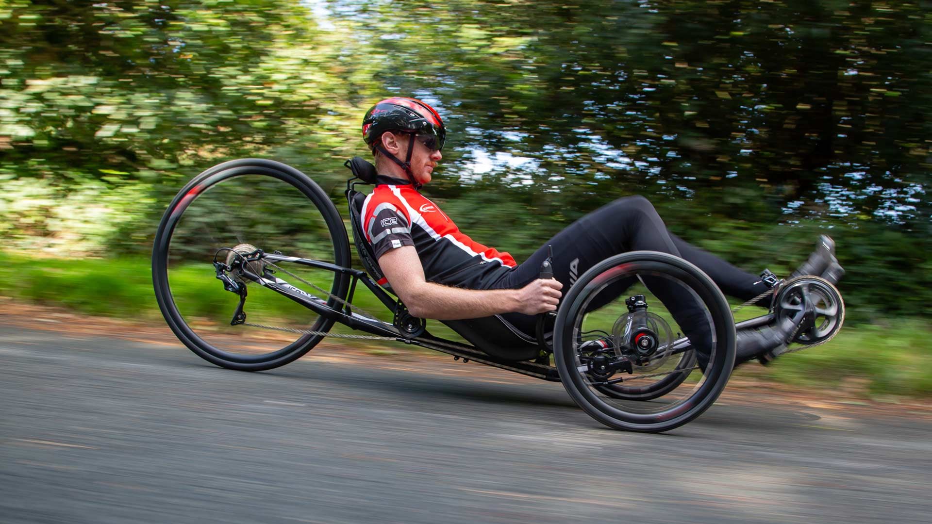 A guy on a trike at speed