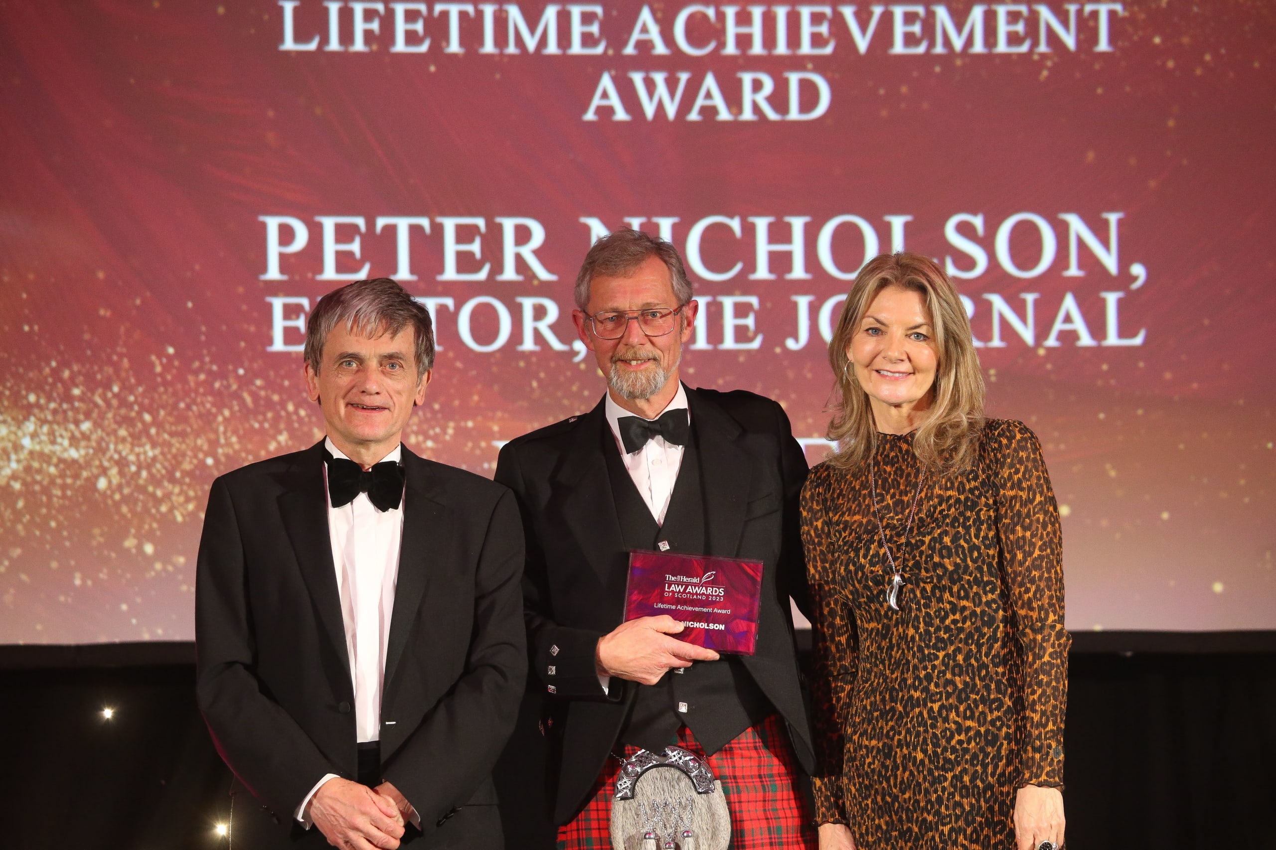 From left to right: Colin Anderson, Chair of the judging panel, Peter Nicholson, editor of the Law Society of Scotland's Journal magazine, Jo Caulfield, awards host.