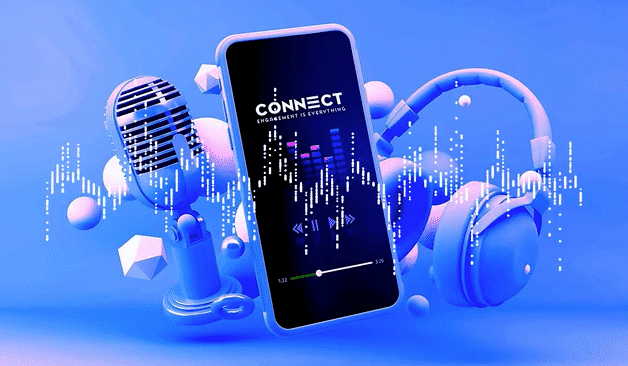 An image of a mobile phone with the Connect logo in the centre of its screen. In the background, there is a microphone and headphones. This is a promotional image to celebrate the launch of our in-house podcast studio, and to celebrate our clients' podcasts so far.