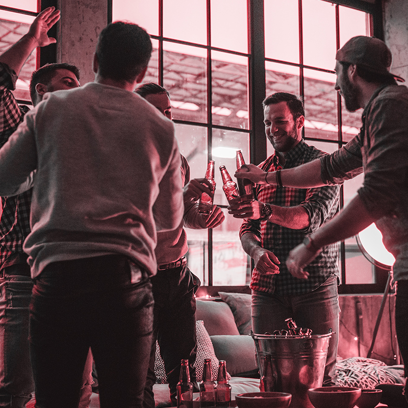 Group of people toasting drinks and celebrating