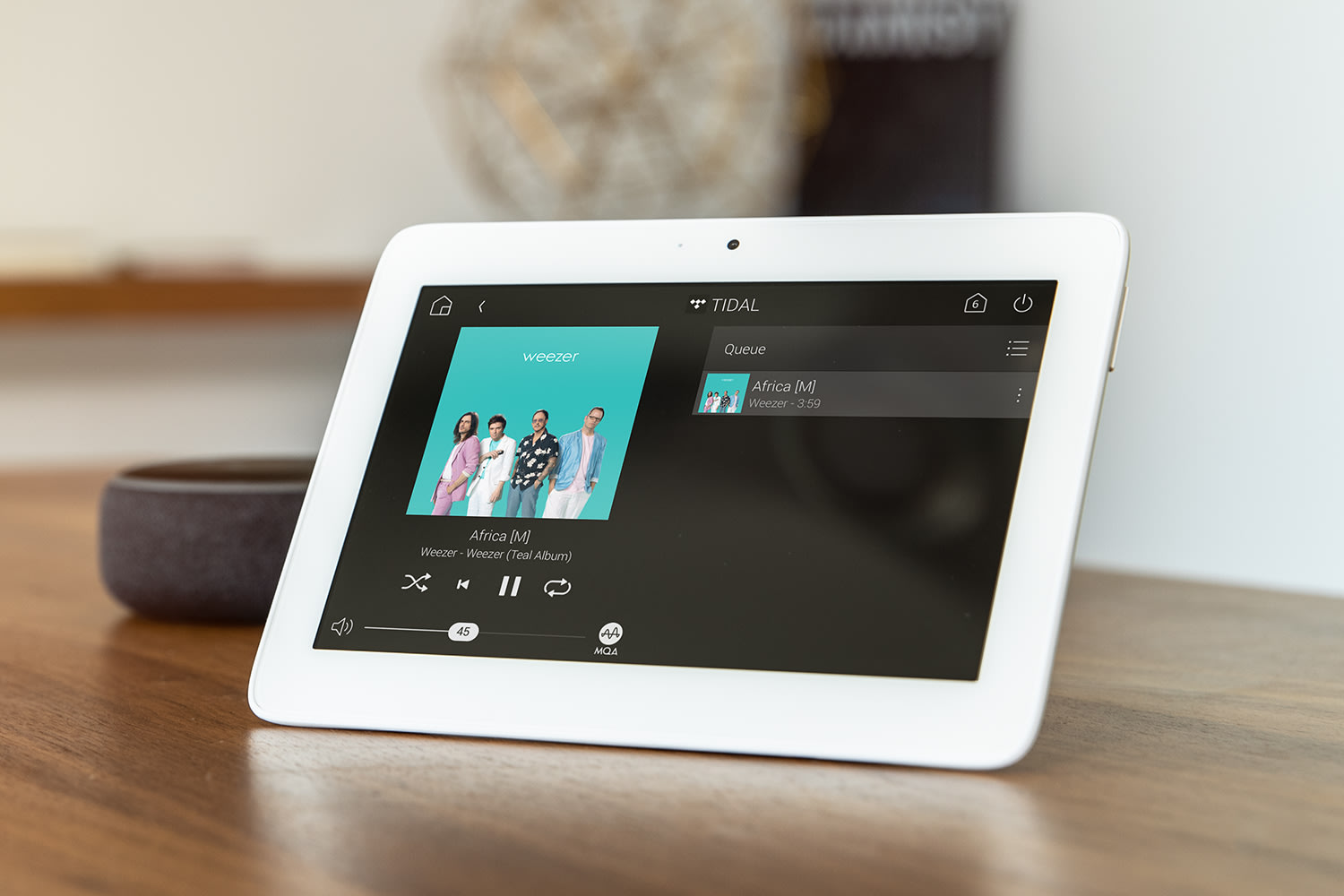 Tabletop touch screen displaying Tidal streaming music service