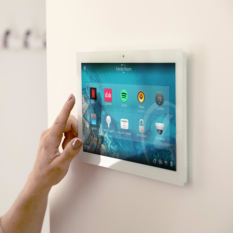 Touchscreen mounted to wall with Control4 App open