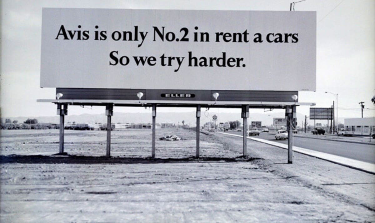 An ad that says “Avis is only No. 2 in rent a cars. So we try harder.”