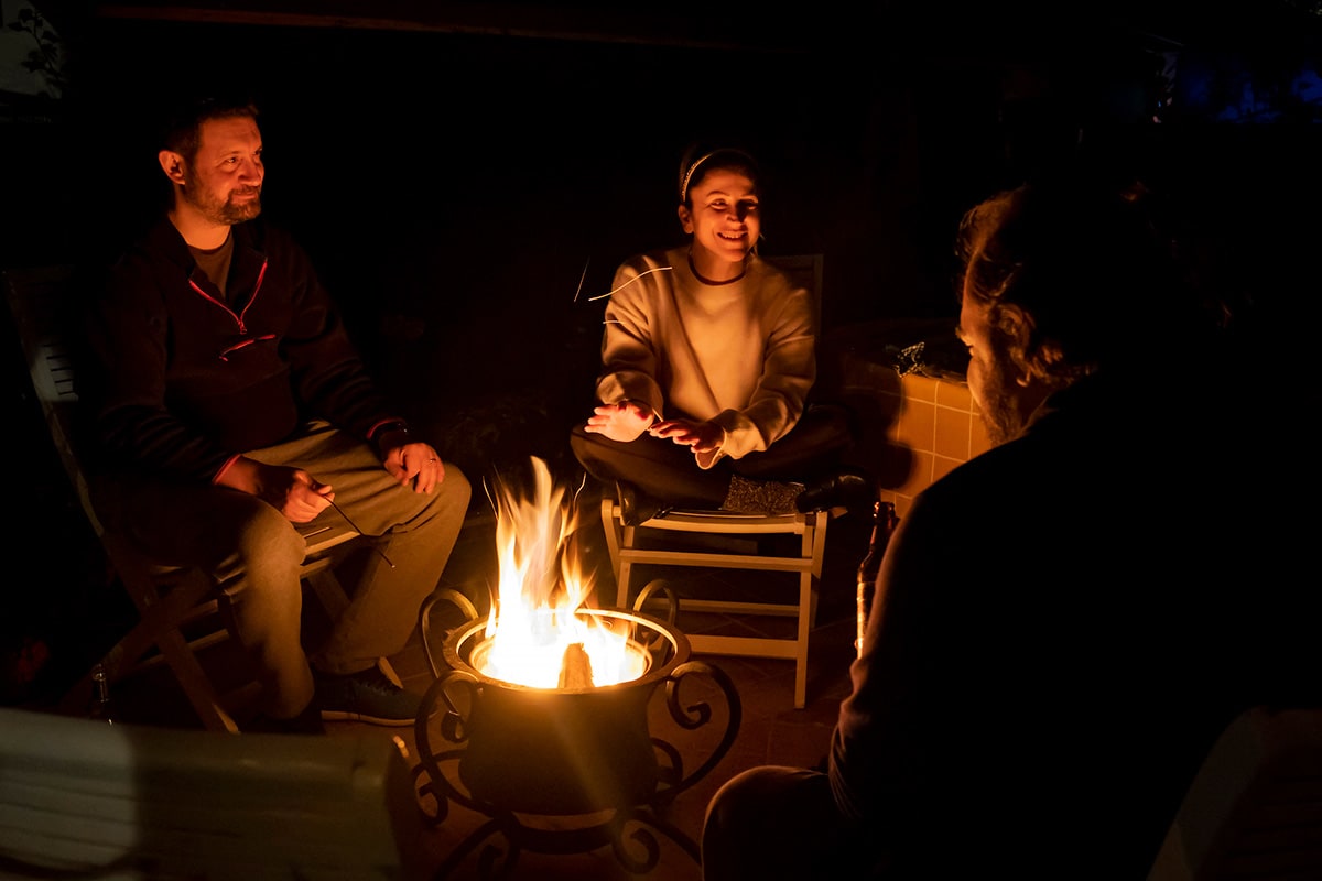 People gathered around a campfire.