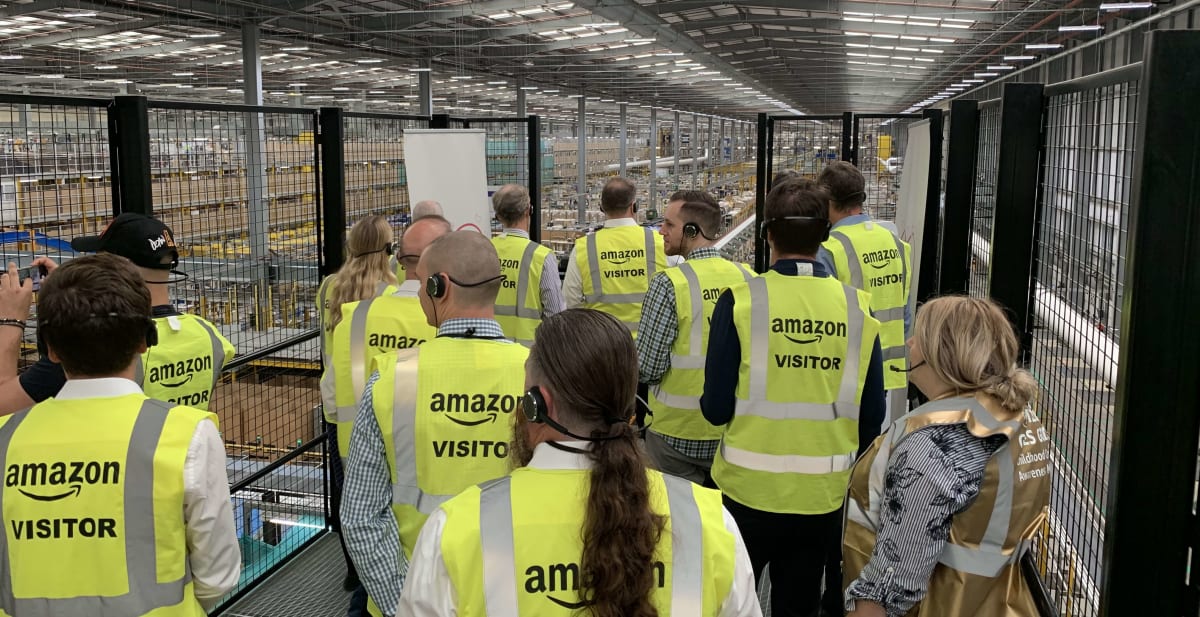 A photo of CRE’s team on an Amazon warehouse tour