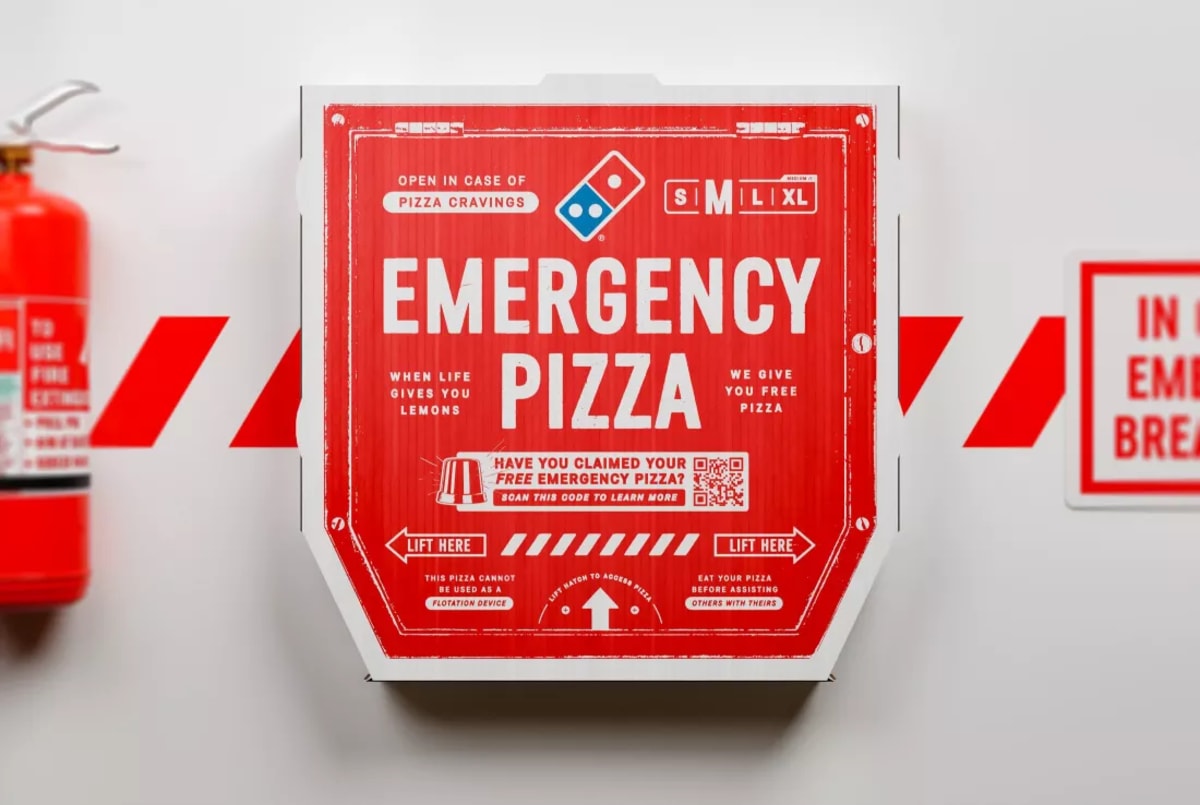 A photo of the emergency pizza box from Dominoes which is packed with copy.