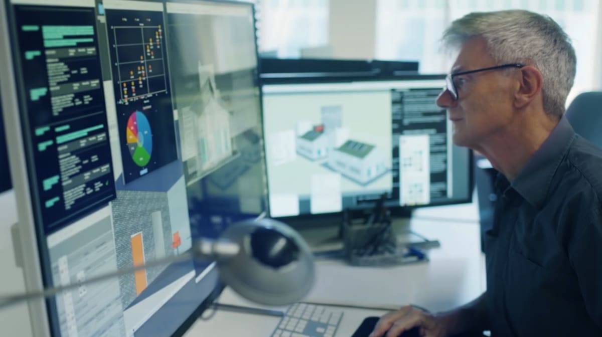 A architect works on plans for a building.