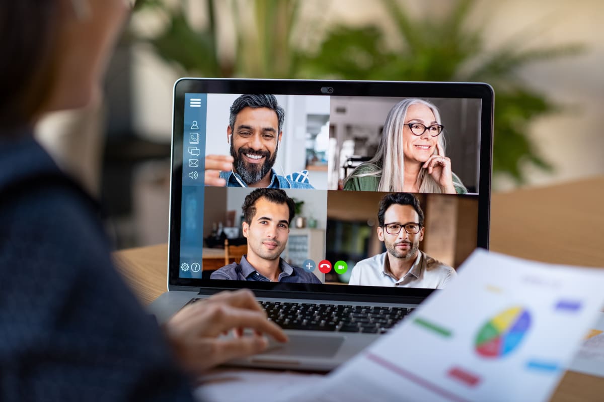 A video call on a laptop.