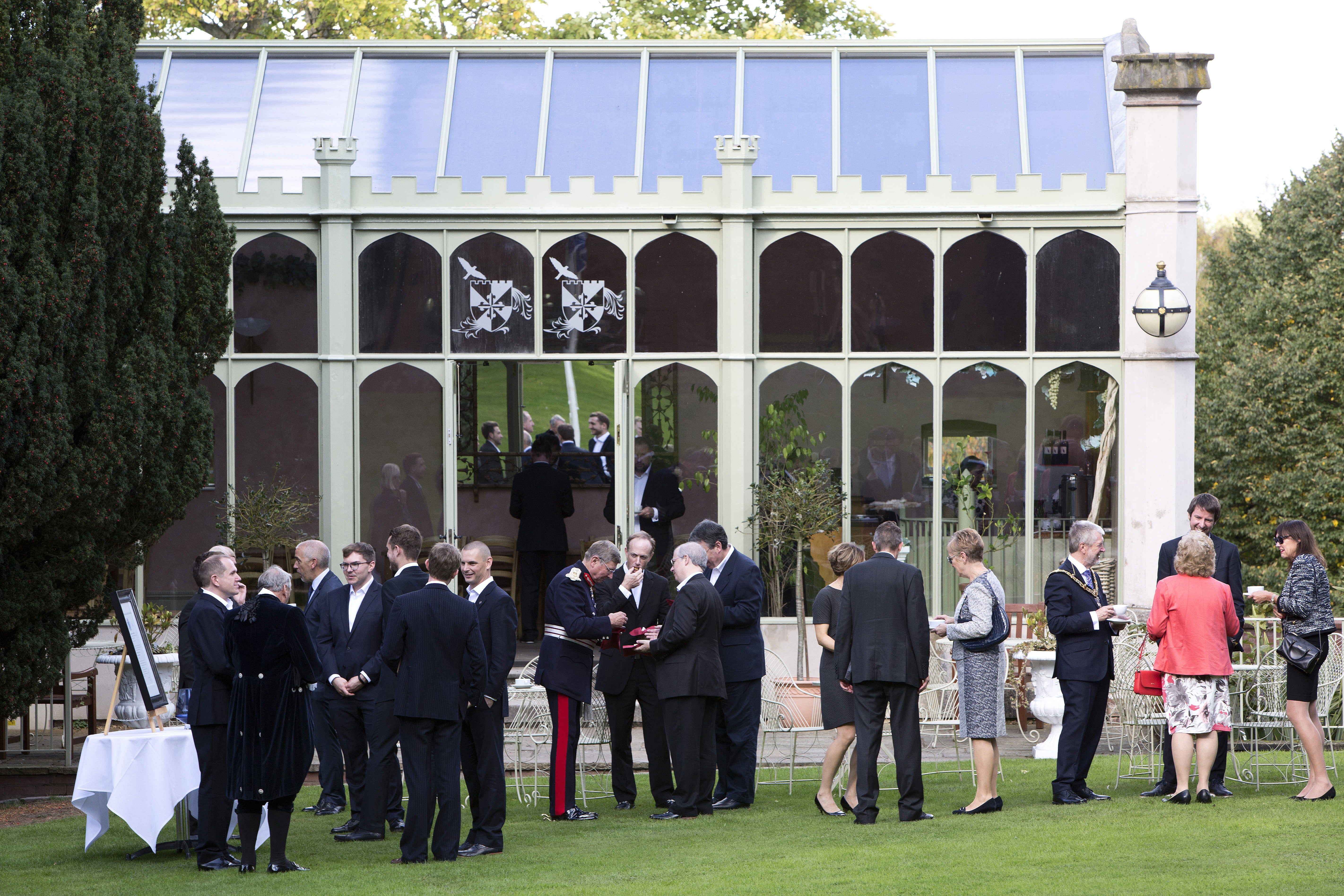 Guests mingling in the garden.