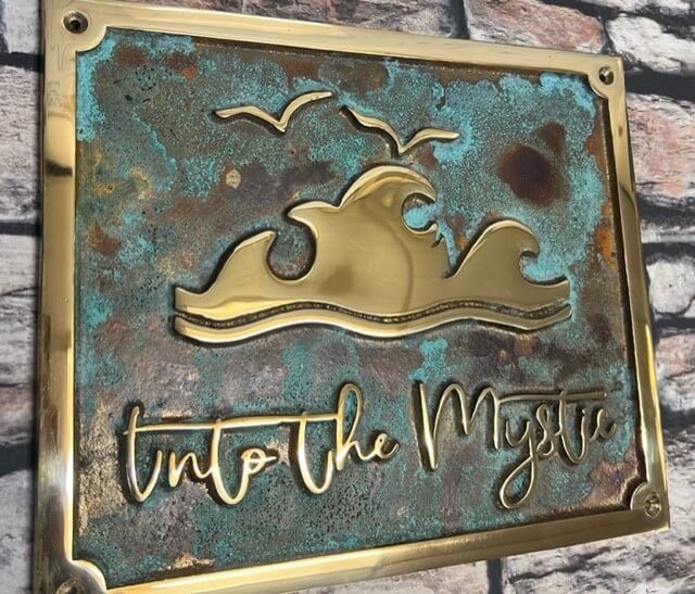 bronze plaque custom with verdigris background.undefined