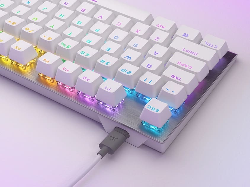 Close up top down shot of K60 PRO TKL from the topside, looking at the side with the detachable USB Type-C Cable and the RGB lighting being displayed.