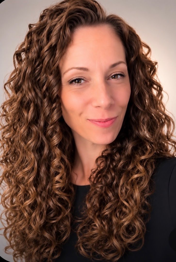White female with red curly hair