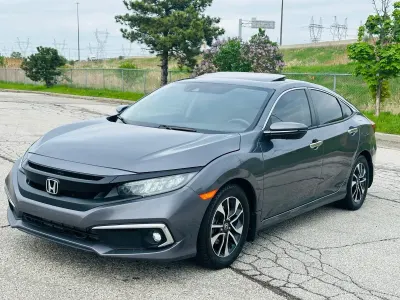 Introducing a 2020 Honda Civic Touring sedan, an exceptional opportunity for dealers seeking quality inventory. With only 82,886 km on the odometer, this vehicle combines reliability and efficiency, hallmarks of the Honda brand, making it a strong contender in the compact sedan market.

Priced competitively at $21,980 CAD, this Civic offers significant value considering its age and mileage. The Touring trim is well-equipped with premium features, enhancing both comfort and driving experience, which can appeal to a broad range of customers.

Given Honda's reputation for durability and strong resale value, this Civic is poised to attract buyers looking for a dependable vehicle, ensuring a profitable return on investment for your dealership. Don't miss out on adding this sought-after model to your inventory.