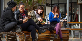 Locals and visitors making the most of  free Wi-Fi in Mildura CBD