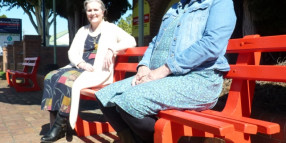 Red benches create awareness of domestic violence