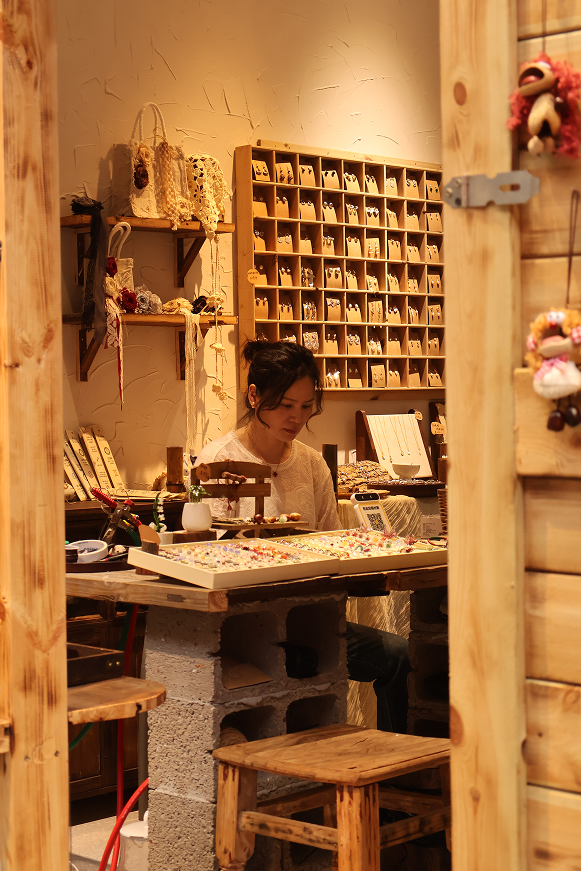 A craft shop glowing with warm light