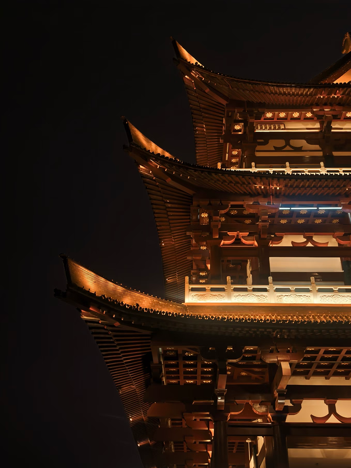 A golden pavilion against the night sky