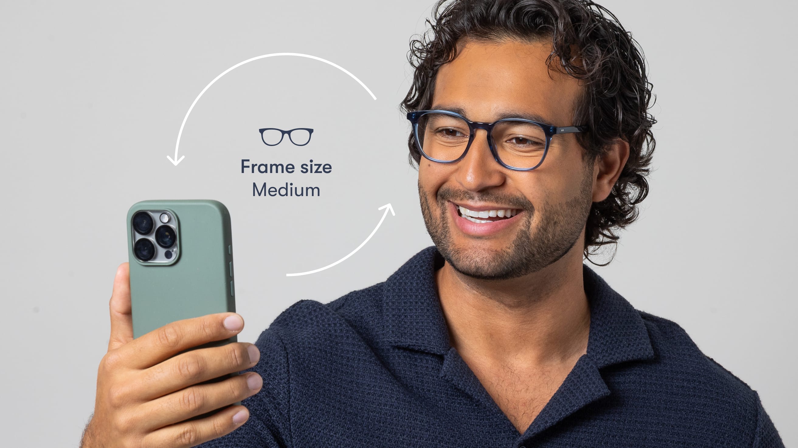 Someone scanning their face with a phone to find their frame size