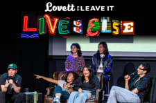 Jon Lovett, Mitra Jouhari, Brian Bahe, Alycia Pascual-Peña, Yasmine Hamady, and Gianmarco Soresi all share a laugh on Stage. The text reads: