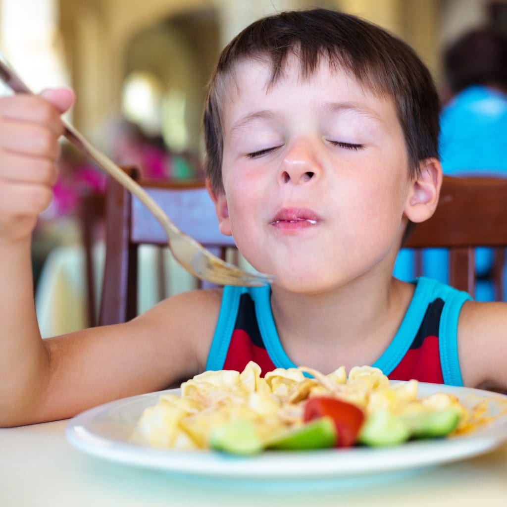 Child enjoying their meal