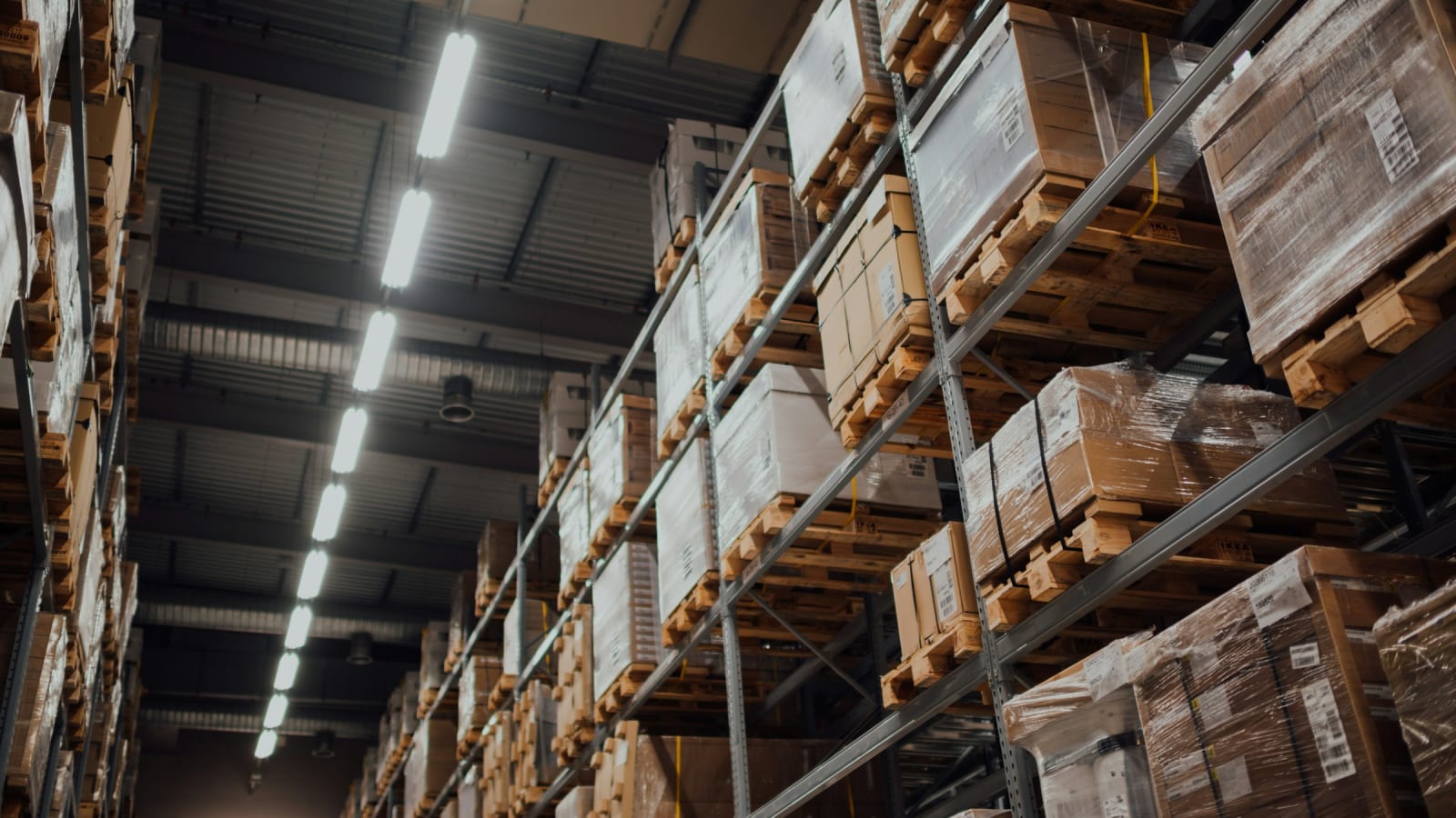 Stacked cartons on racking in a distribution warehouse
