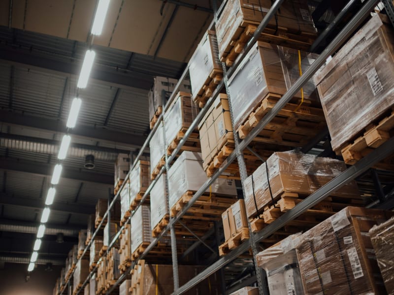 Stacked cartons on racking in a distribution warehouse