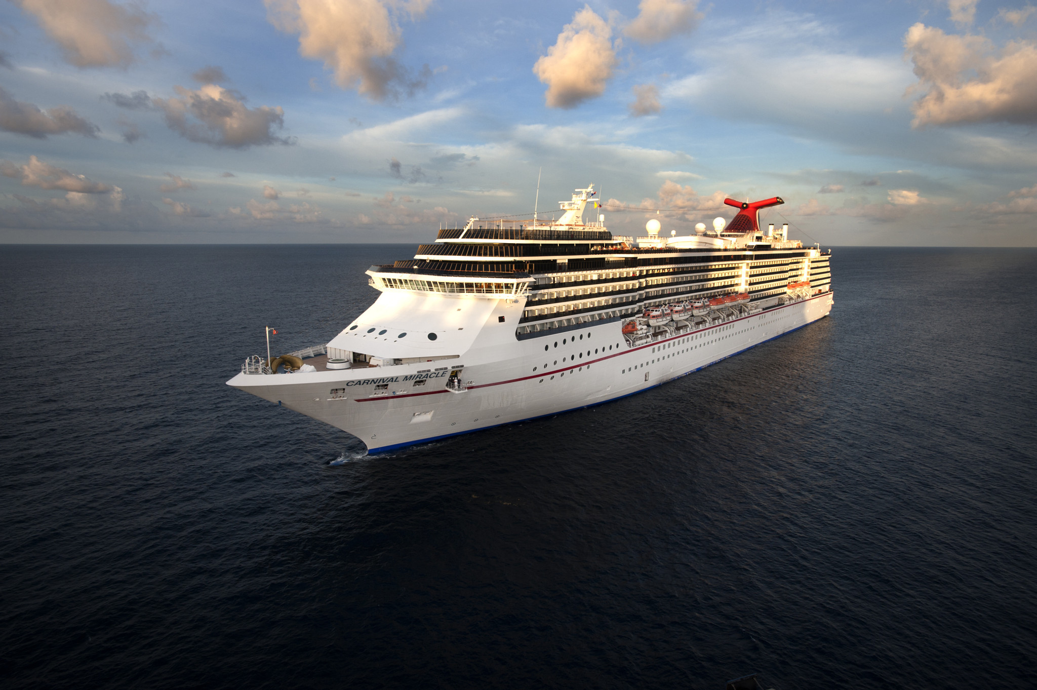 Aerial view of Carnival Miracle cruising forward in Western Caribbean.